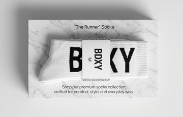 Box of BDXY socks on a light gray background